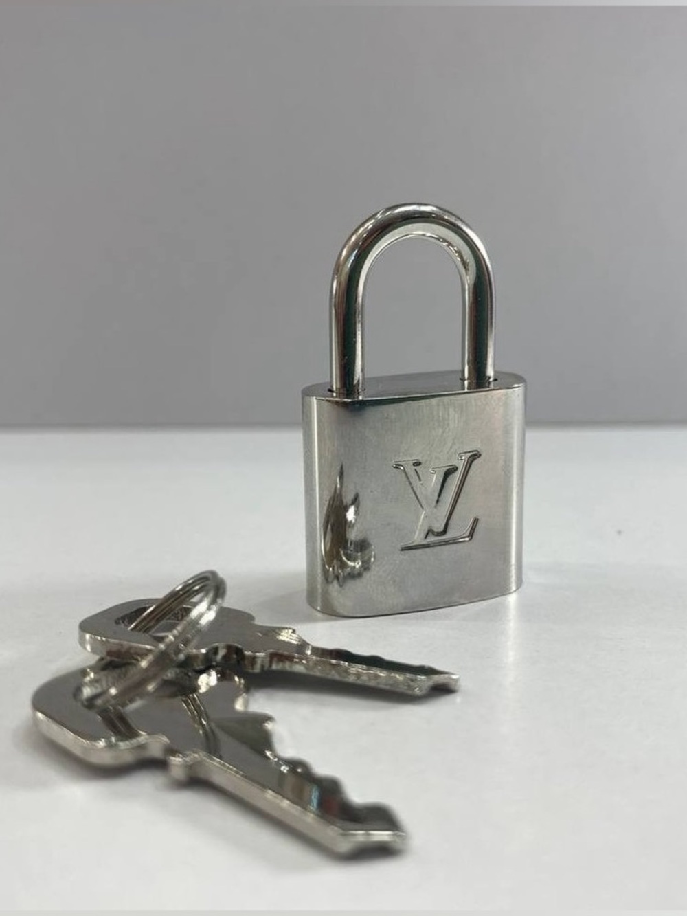Louis Vuitton Silver-Tone LV Engraved Padlock with Keys
